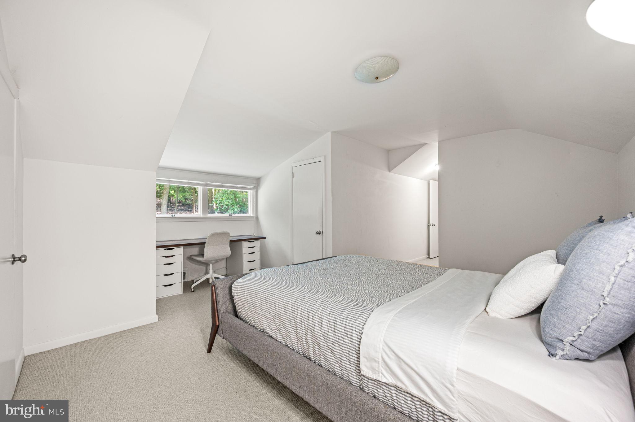 434 Pugh Road Wayne, PA 19087 - Photo 40 of 47 a bedroom with a bed and a table in it