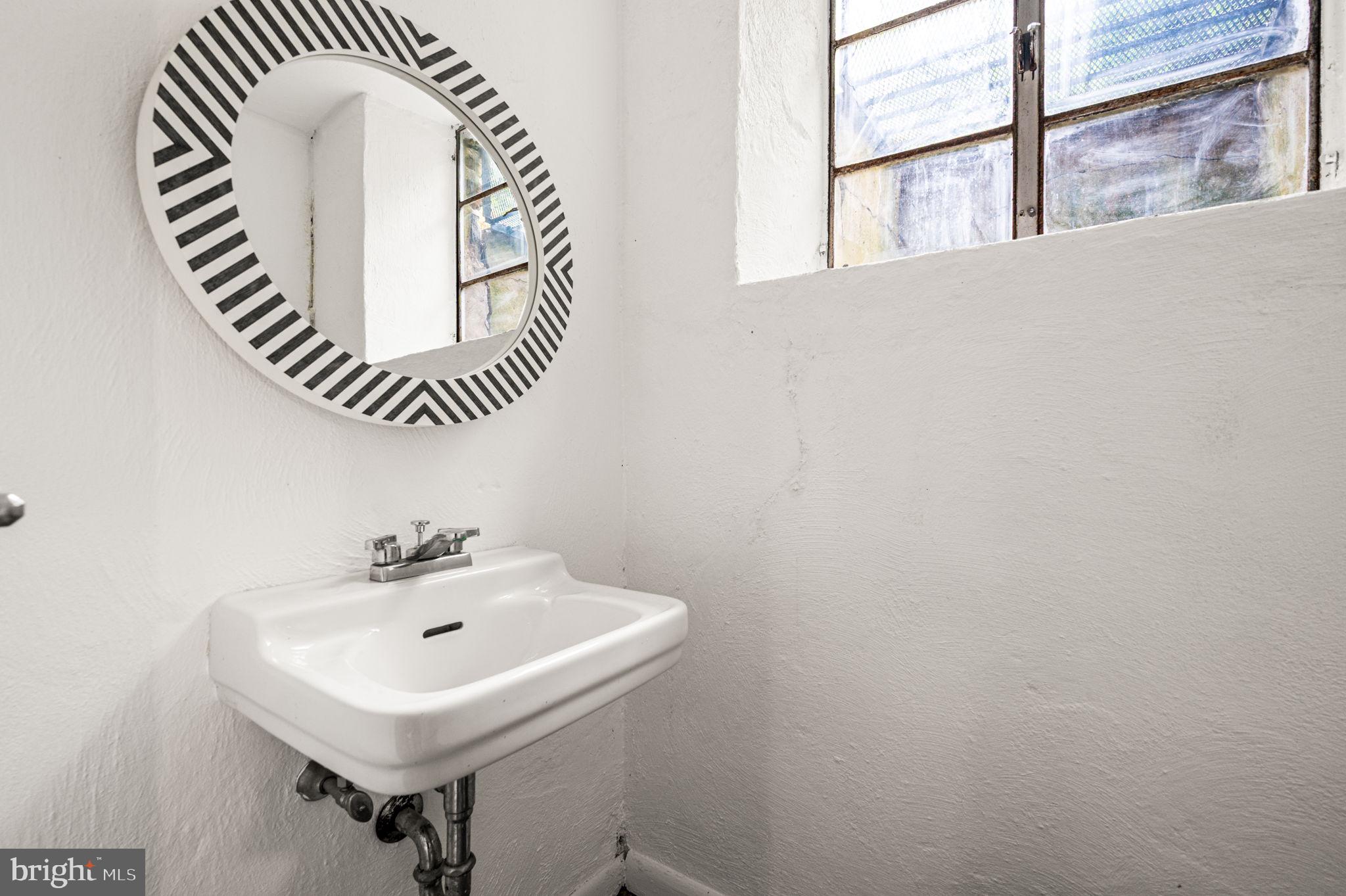 434 Pugh Road Wayne, PA 19087 - Photo 45 of 47 a bathroom with a sink and a mirror