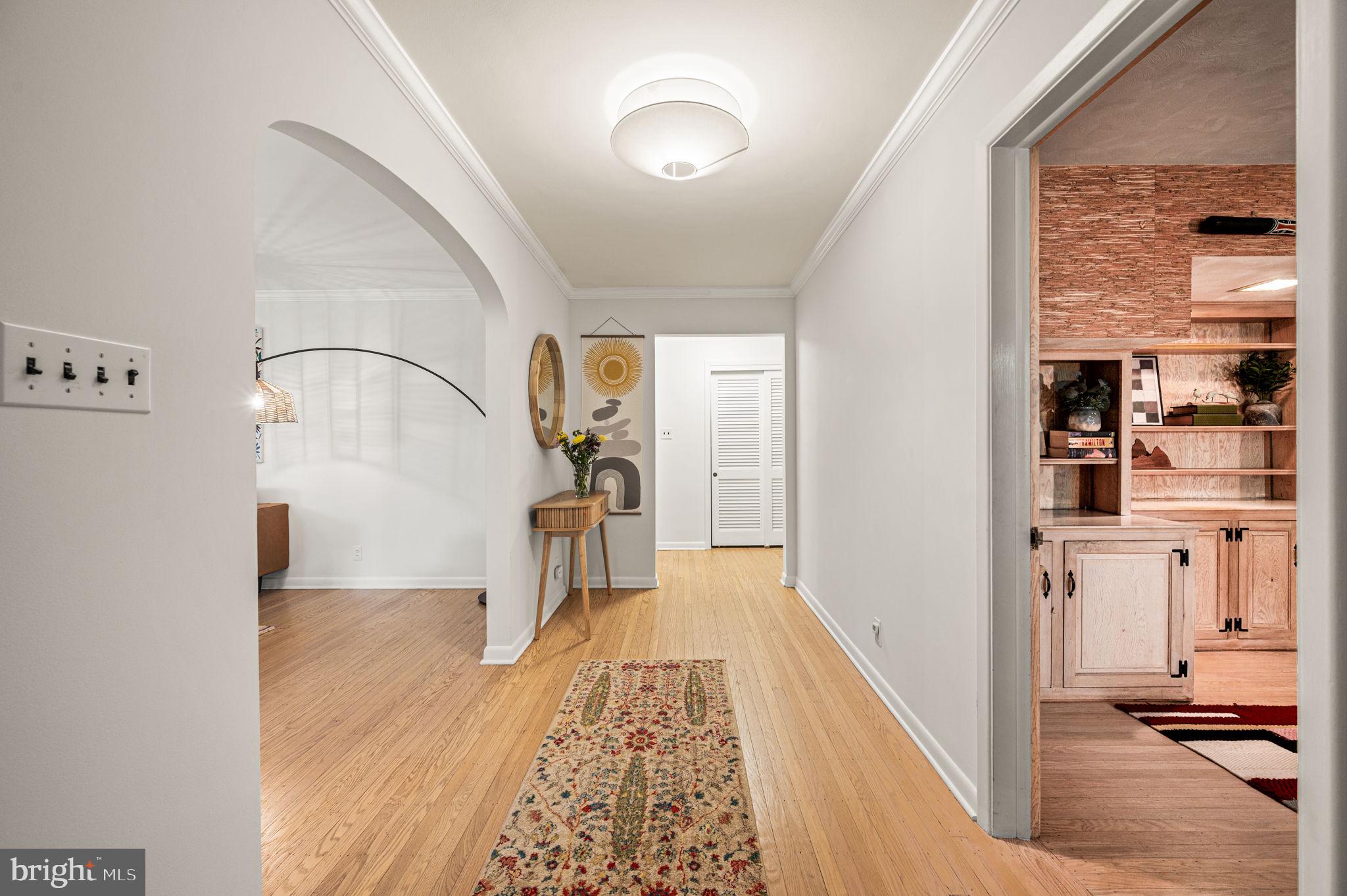 434 Pugh Road Wayne, PA 19087 - Photo 8 of 47 a view of a hallway with wooden floor and furniture