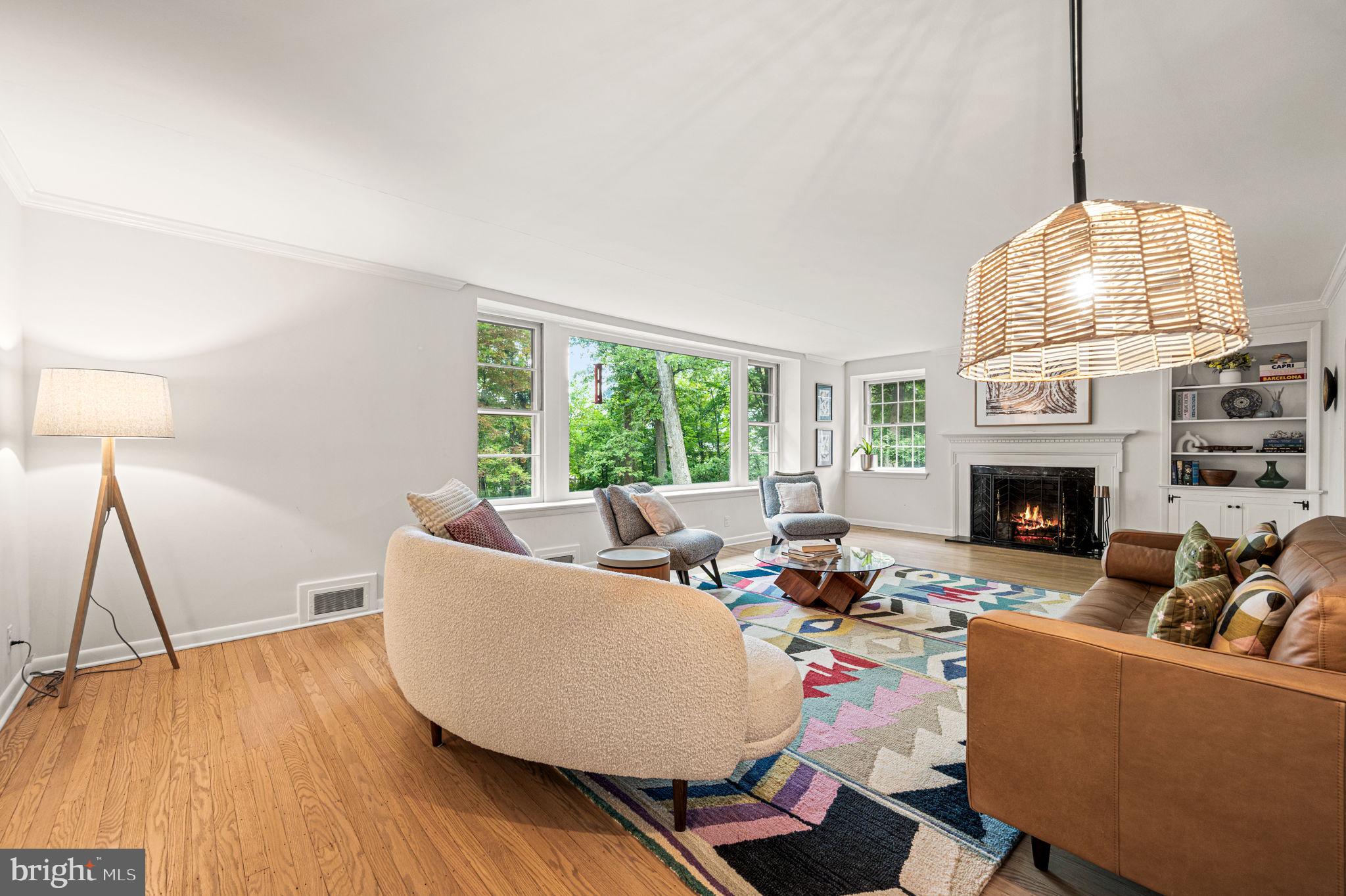 434 Pugh Road Wayne, PA 19087 - Photo 10 of 47 a living room with furniture a fireplace and a chandelier