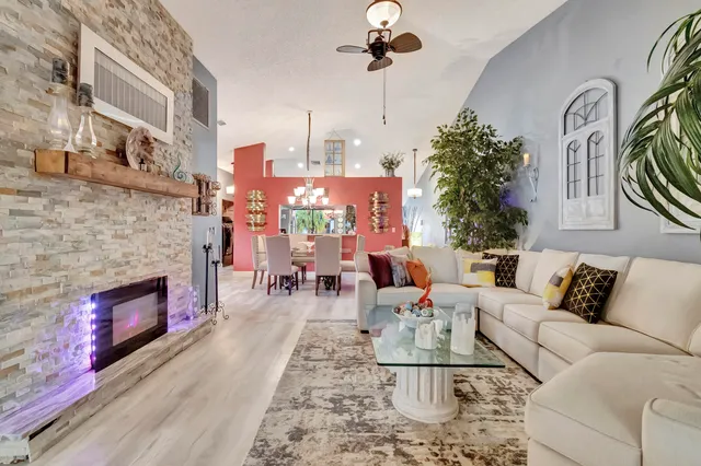 a living room with furniture and a fireplace