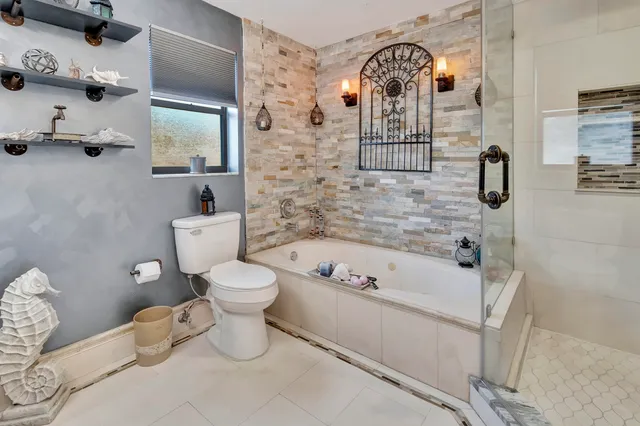 a bathroom with a toilet sink and bathtub