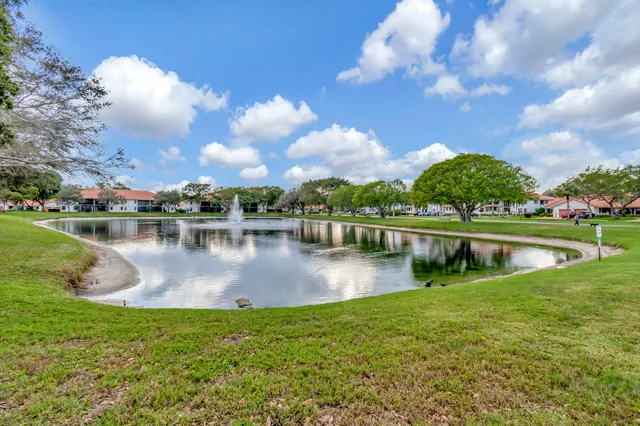 a view of a lake with houses in the background