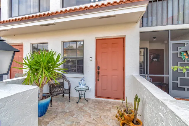 a view of balcony with furniture