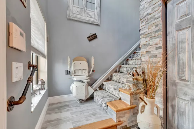 a view of entryway and hall with wooden floor