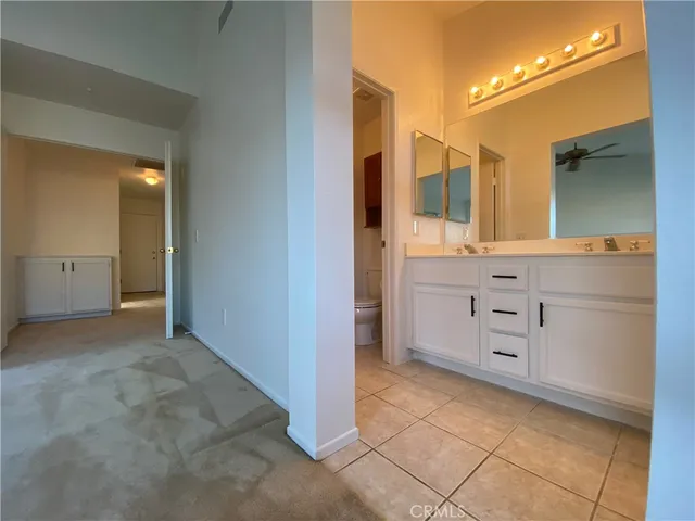 a view of a bathroom with a sink and a mirror