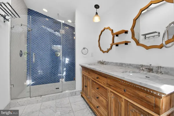 a bathroom with a sink double vanity and a mirror