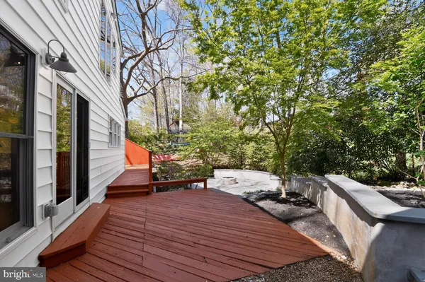 a view of a backyard with sitting area