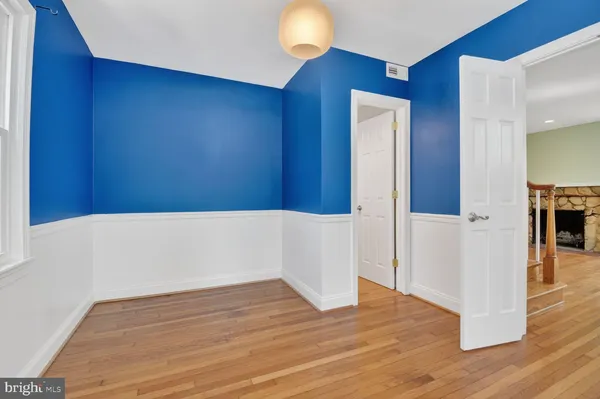 a view of livingroom with hardwood floor and a ceiling fan