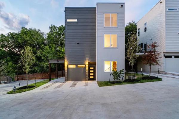 a view of a house with entertaining space and a street view
