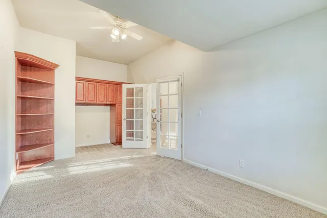 a front view of a house with yard and green space