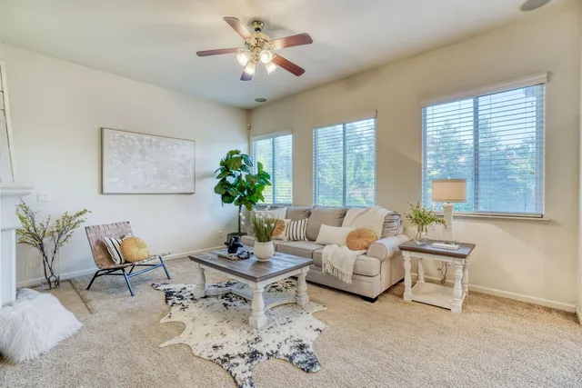a view of a house with a backyard and swimming pool