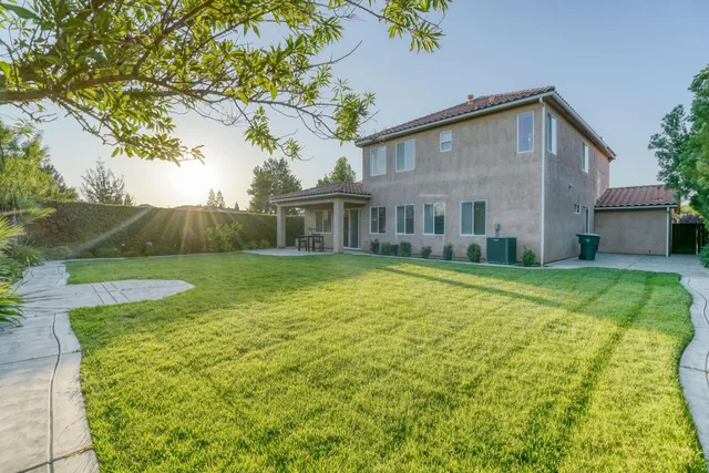 a spacious bedroom with a bed and window