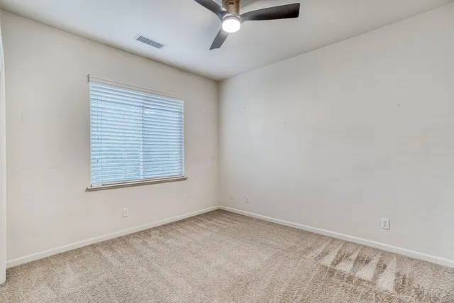 front view of a house with potted plants