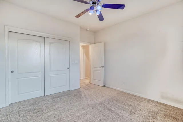 a front view of a house with a garden and plants