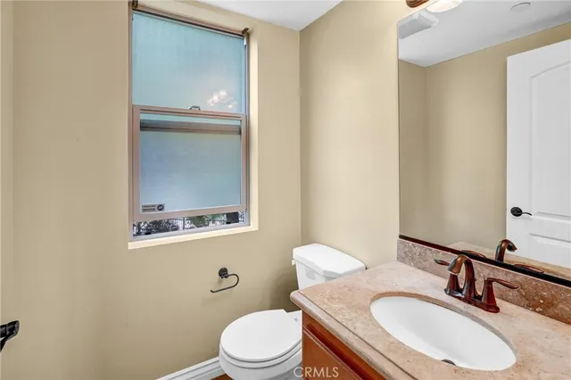 a spacious bedroom with a bed and a couch