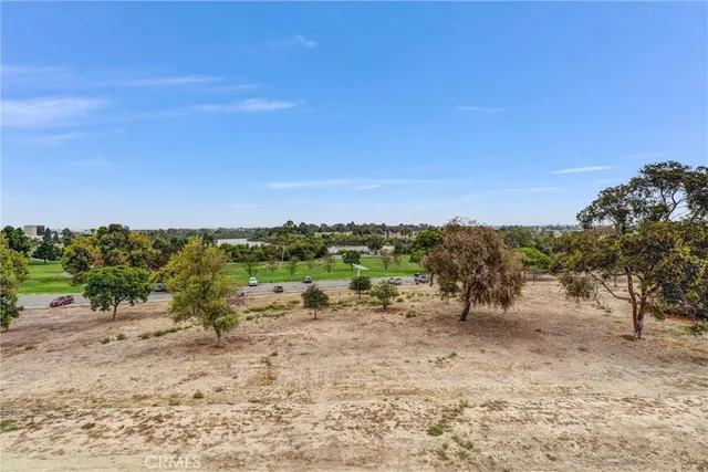 a picture of a room with a white wall and a refrigerator