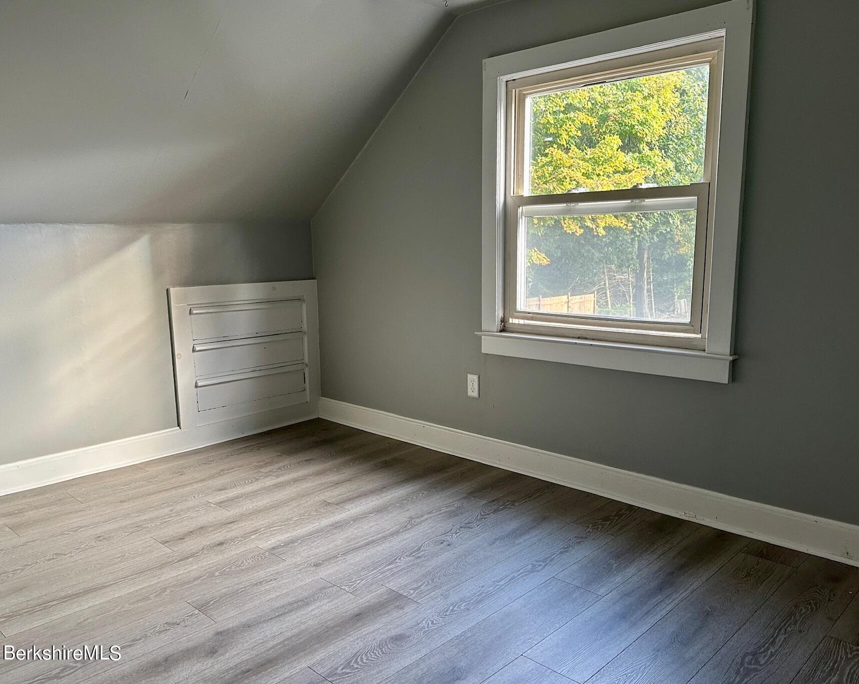 80 Preston Avenue Pittsfield, MA 01201 - Photo 23 of 33 an empty room with wooden floor and windows