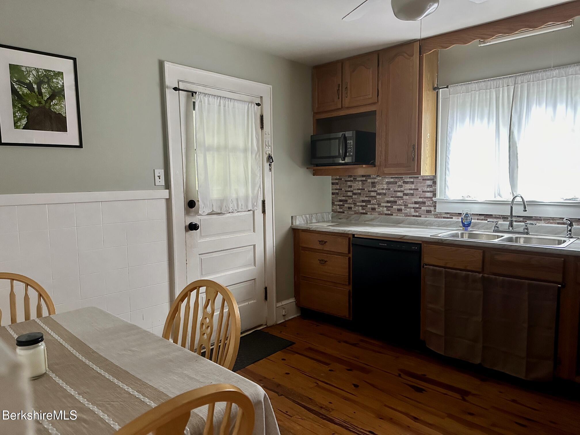 80 Preston Avenue Pittsfield, MA 01201 - Photo 3 of 33 a kitchen with granite countertop a stove a sink and a microwave