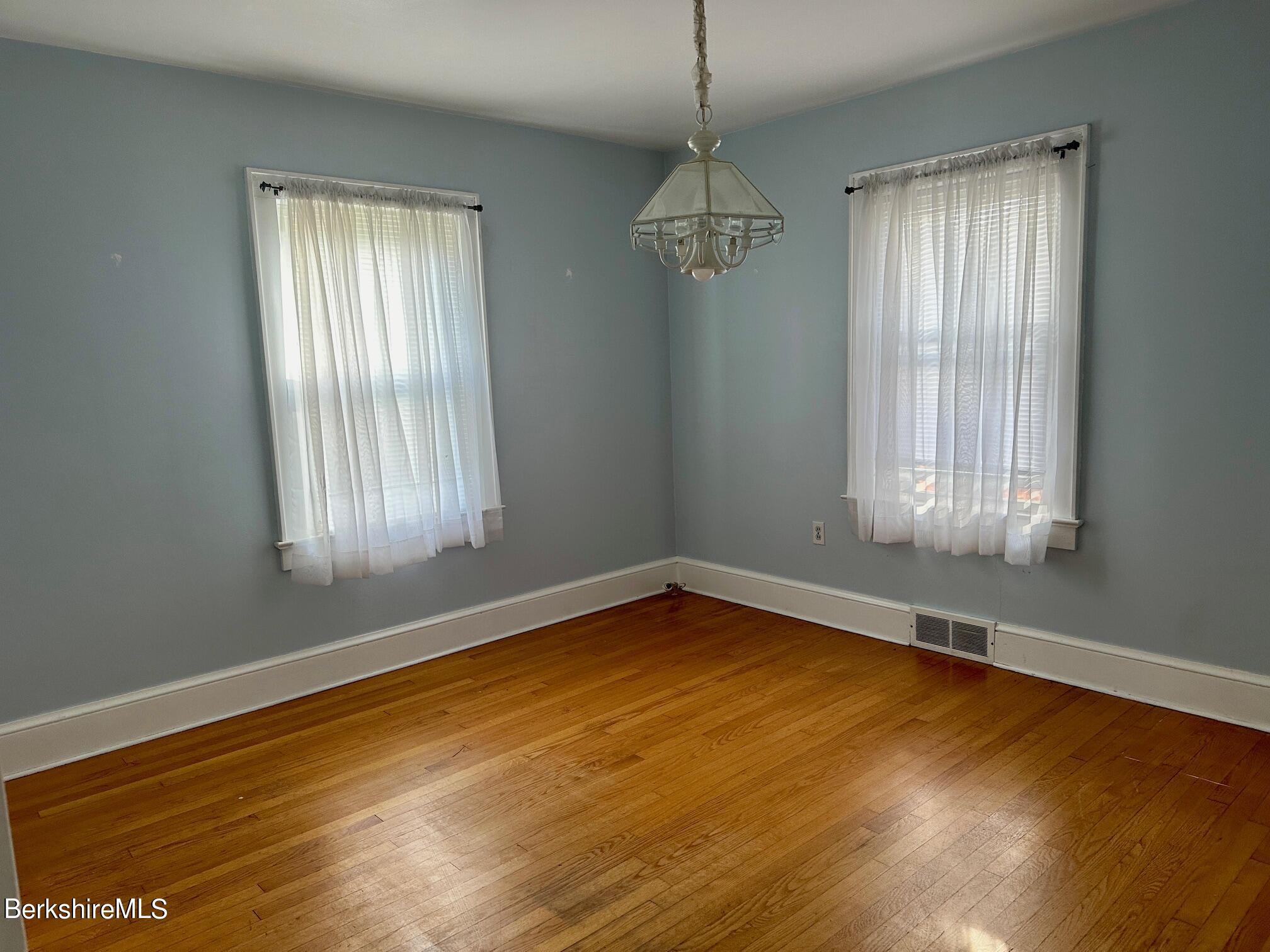 80 Preston Avenue Pittsfield, MA 01201 - Photo 6 of 33 a view of empty room with wooden floor and fan