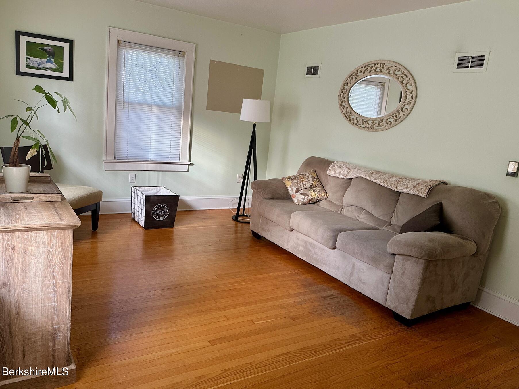 80 Preston Avenue Pittsfield, MA 01201 - Photo 8 of 33 a living room with furniture and a wooden floor
