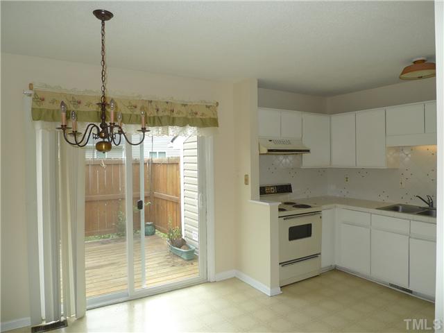 6018 Farm Gate Road Raleigh, NC 27606 - Photo 4 of 6 Casual Dining Area with Doors to Deck