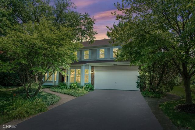 a view of a house with a tree