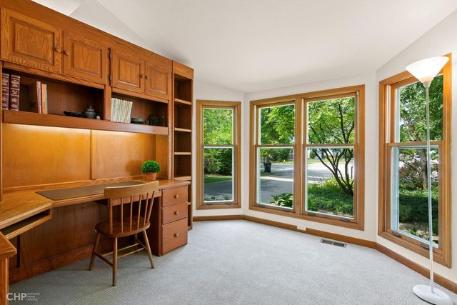 a view of a workspace with furniture