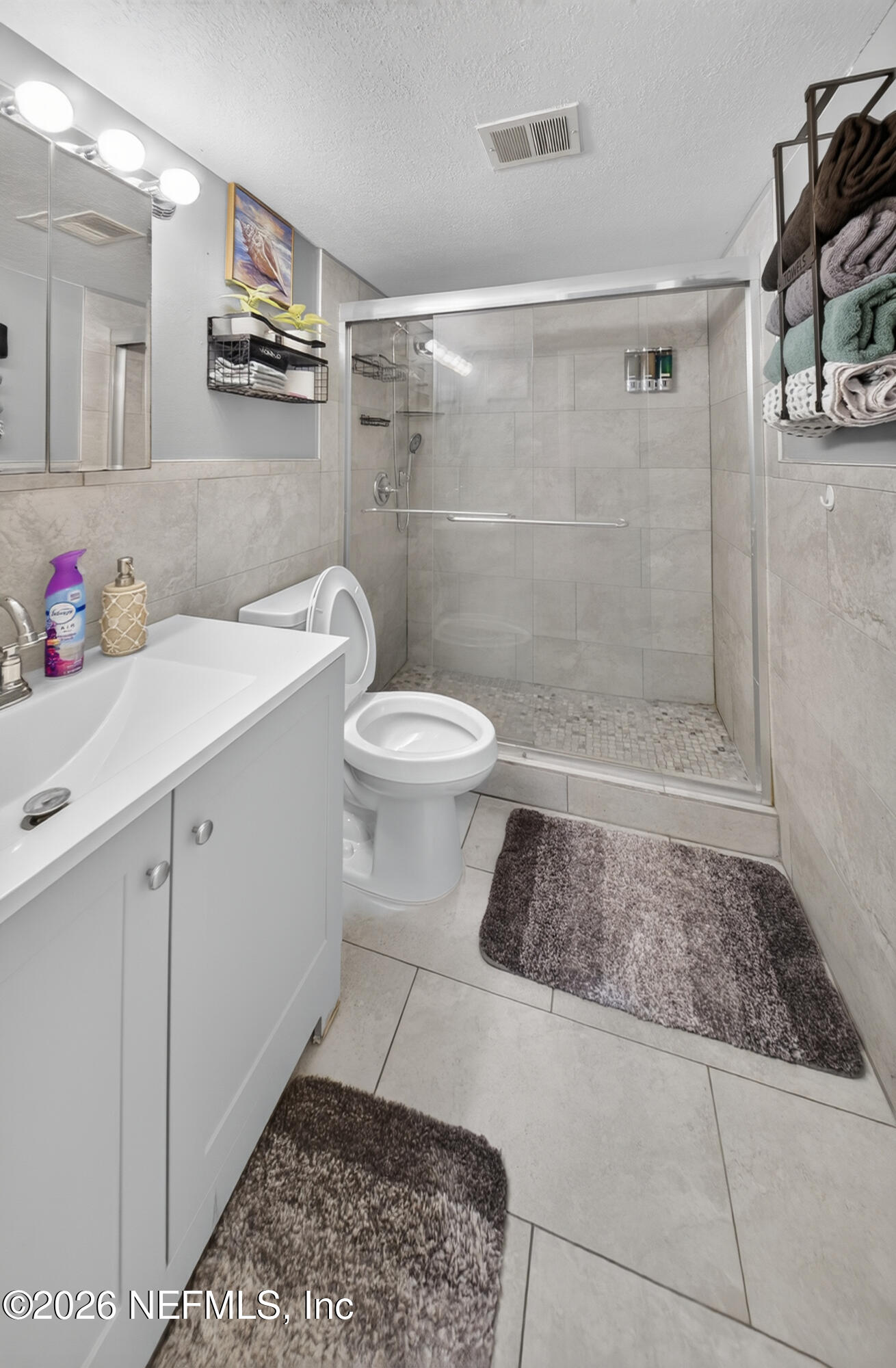 7346 El Barco Road, Unit 4 Jacksonville, FL 32216 - Photo 10 of 19 a bathroom with a sink a toilet and shower