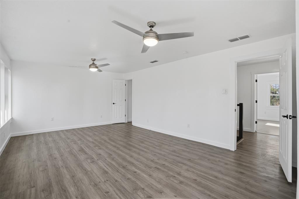3148 Medlin Road East Mountain, TX 75645 - Photo 19 of 36 a view of an empty room and wooden floor