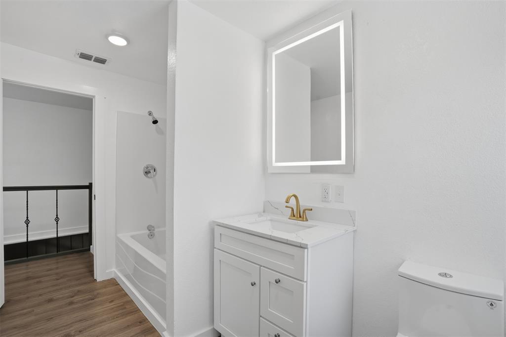3148 Medlin Road East Mountain, TX 75645 - Photo 23 of 36 a bathroom with a sink toilet and tub