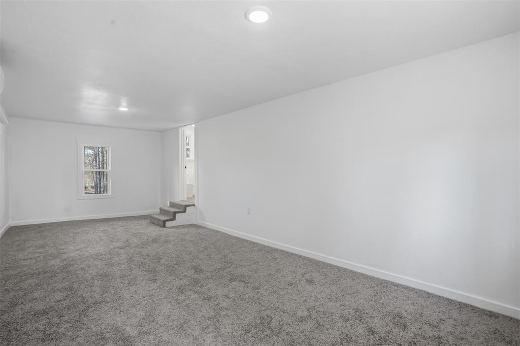 3148 Medlin Road East Mountain, TX 75645 - Photo 29 of 36 an empty room with windows