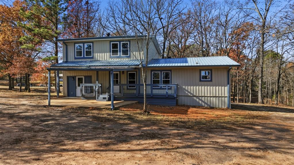 3148 Medlin Road East Mountain, TX 75645 - Photo 4 of 36 a house that has a tree in front of it