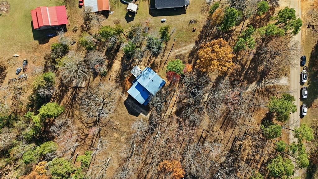 3148 Medlin Road East Mountain, TX 75645 - Photo 8 of 36 an aerial view of a house with a yard