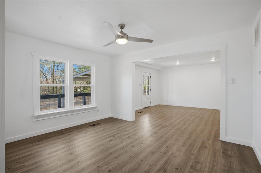 3148 Medlin Road East Mountain, TX 75645 - Photo 10 of 36 wooden floor in an empty room with a window