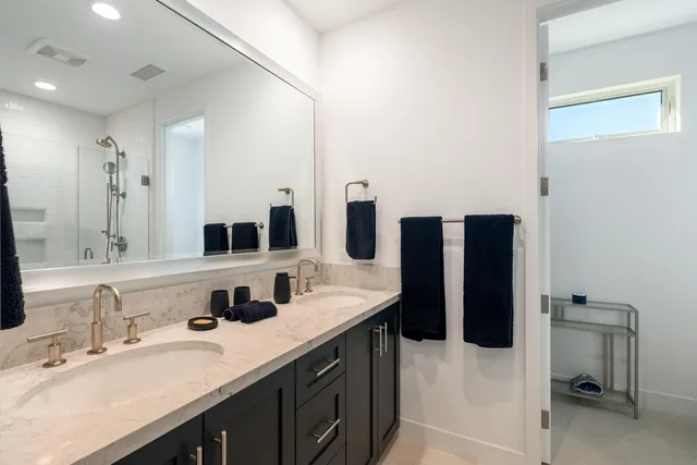 a backyard of a house with sofas fire pit and outdoor seating