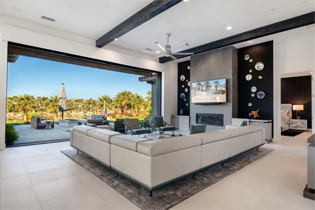 a living room with fireplace furniture and a flat screen tv