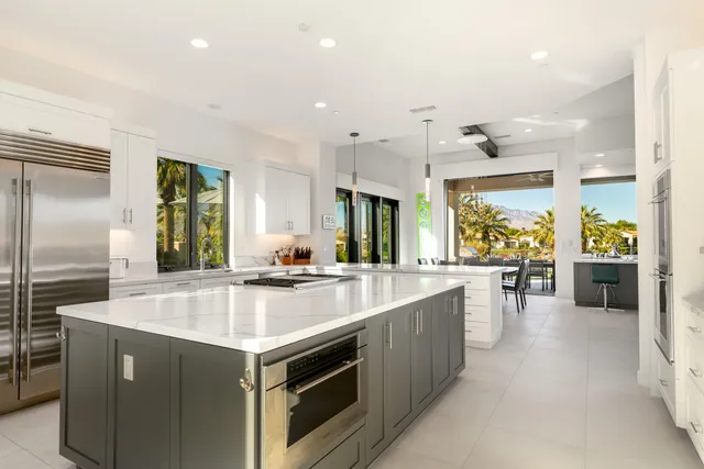 a bathroom with a toilet a sink and shower