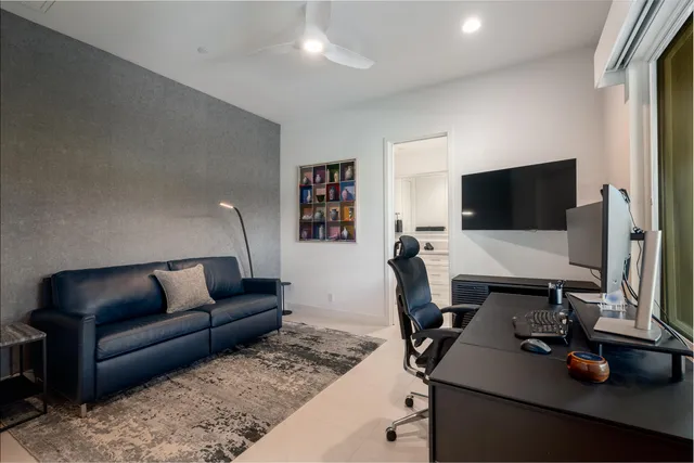 a kitchen with refrigerator and window