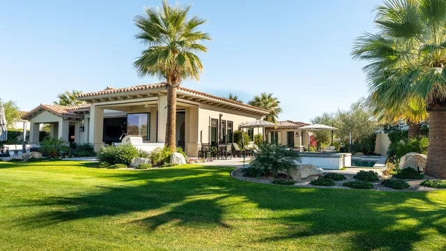 a view of a big yard with front of house