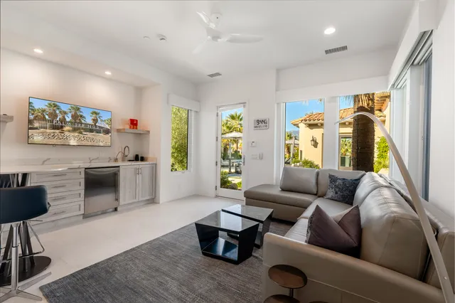 a bedroom with a bed and a couch