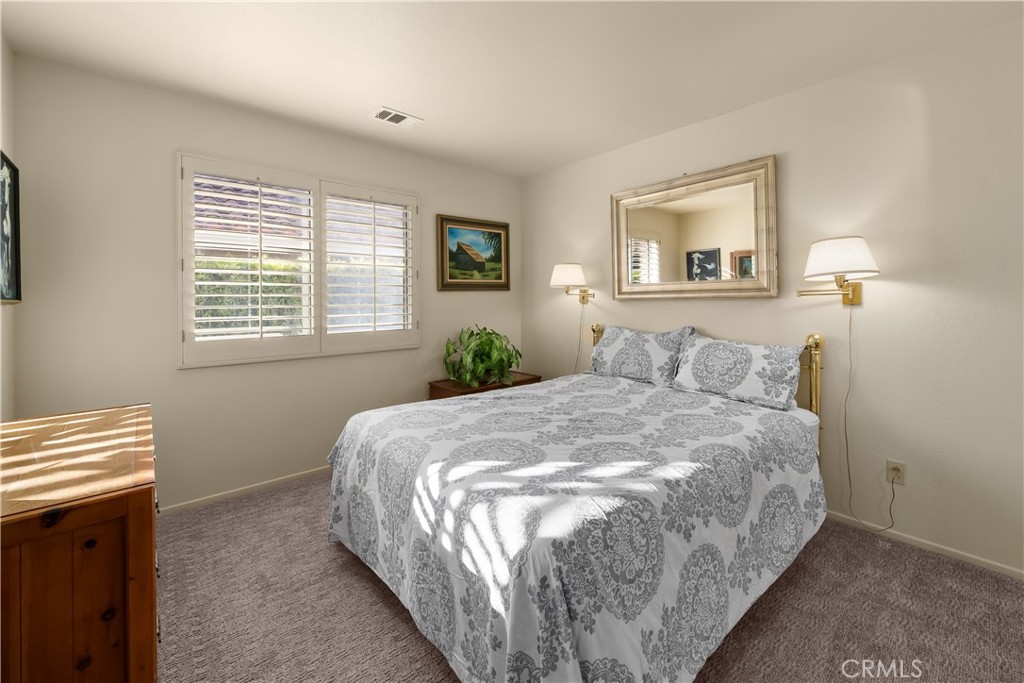 634 Riviera Circle Nipomo, CA 93444 - Photo 28 of 40 a large bed sitting in a bedroom next to a window