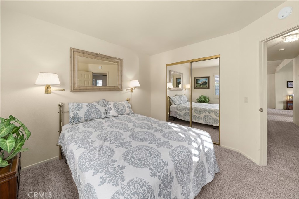 634 Riviera Circle Nipomo, CA 93444 - Photo 30 of 40 a bedroom with a bed and a painting on the wall