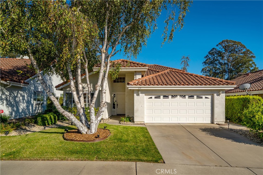 634 Riviera Circle Nipomo, CA 93444 - Photo 3 of 40 a front view of a house with a yard