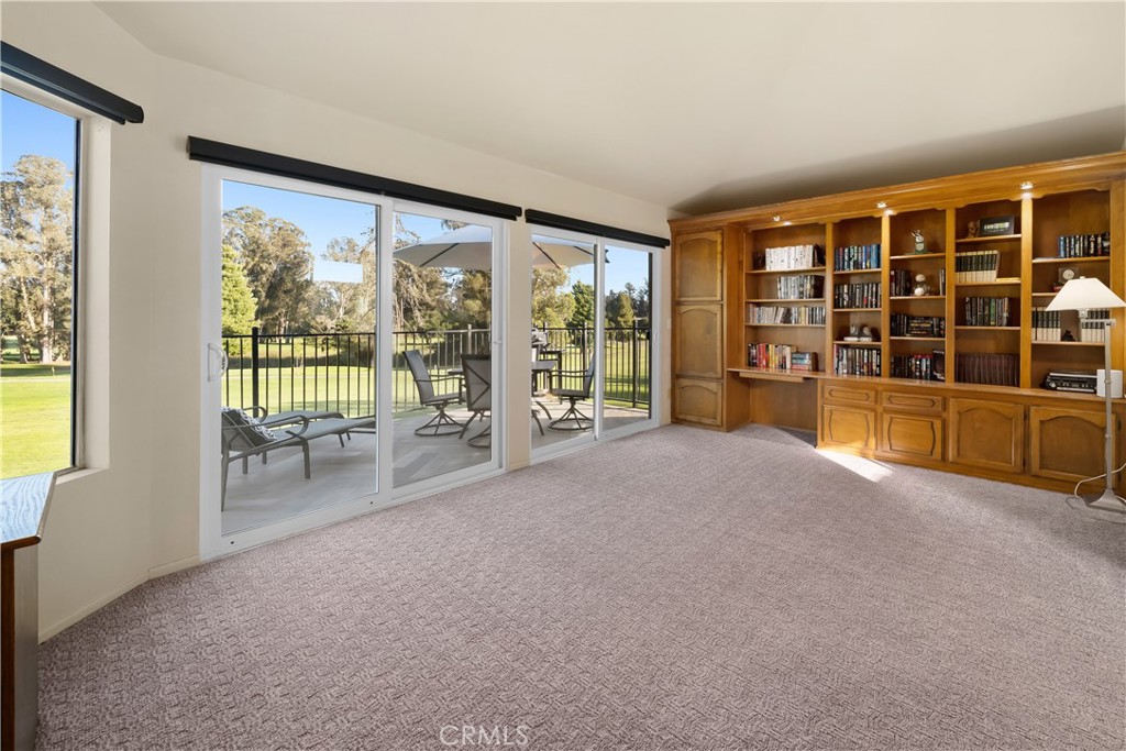 634 Riviera Circle Nipomo, CA 93444 - Photo 31 of 40 a view of an empty room with wooden floor and a floor to ceiling window