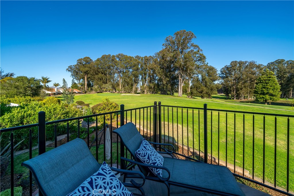 634 Riviera Circle Nipomo, CA 93444 - Photo 38 of 40 a view of a chair and table on the wooden floor