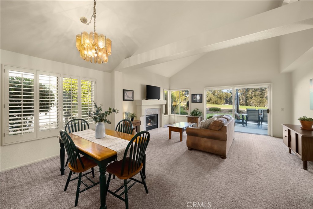 634 Riviera Circle Nipomo, CA 93444 - Photo 4 of 40 a view of a dining room with furniture a livingroom and chandelier