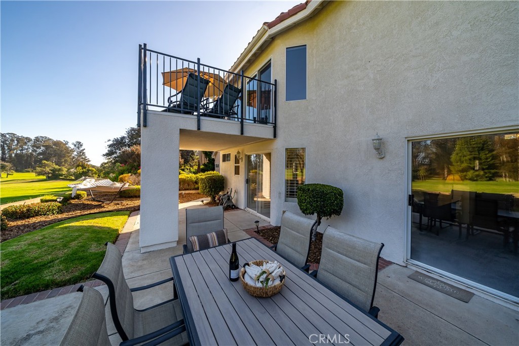 634 Riviera Circle Nipomo, CA 93444 - Photo 10 of 40 a view of a patio with couches chairs and potted plants