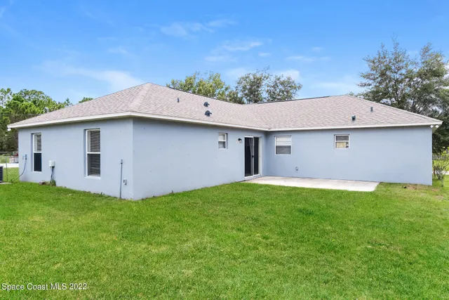 a aerial view of a house and garden