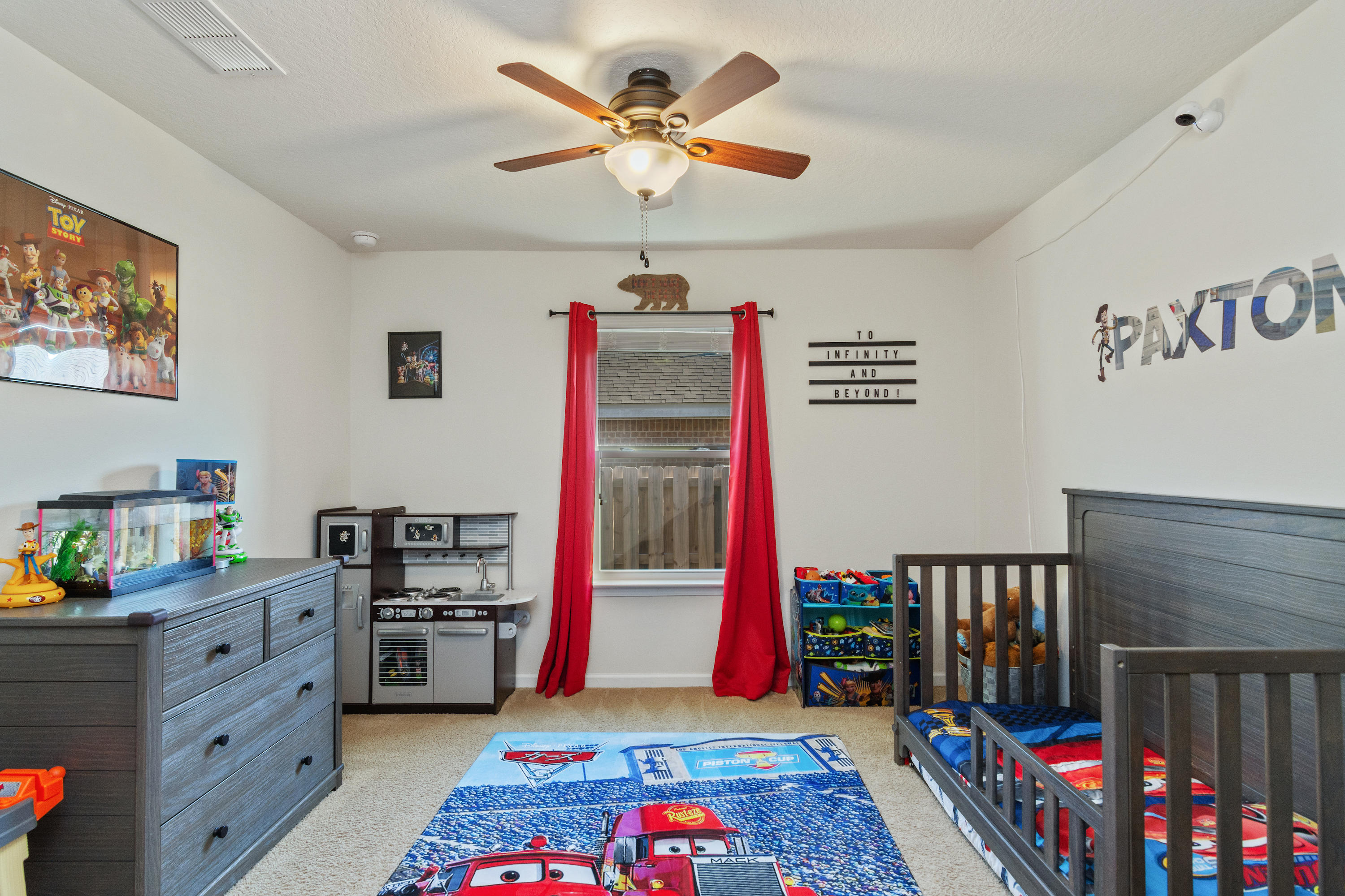 501 Merganser Way Crestview, FL 32539 - Photo 16 of 34 a bedroom with a bed and a chandelier